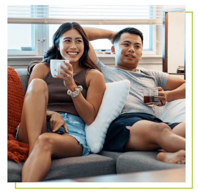 Namewee and woman sitting next to a window