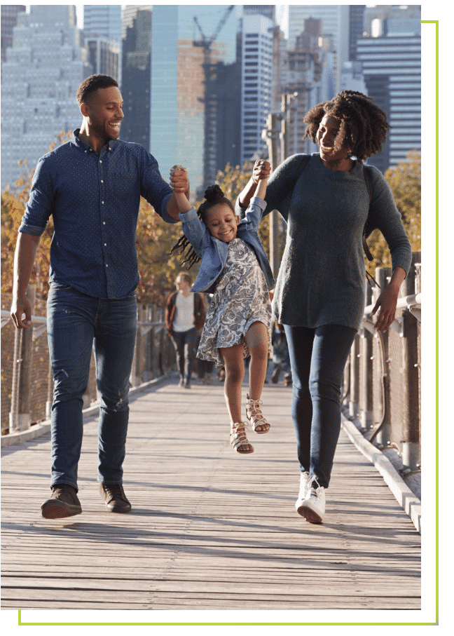 a group of people walking on a sidewalk